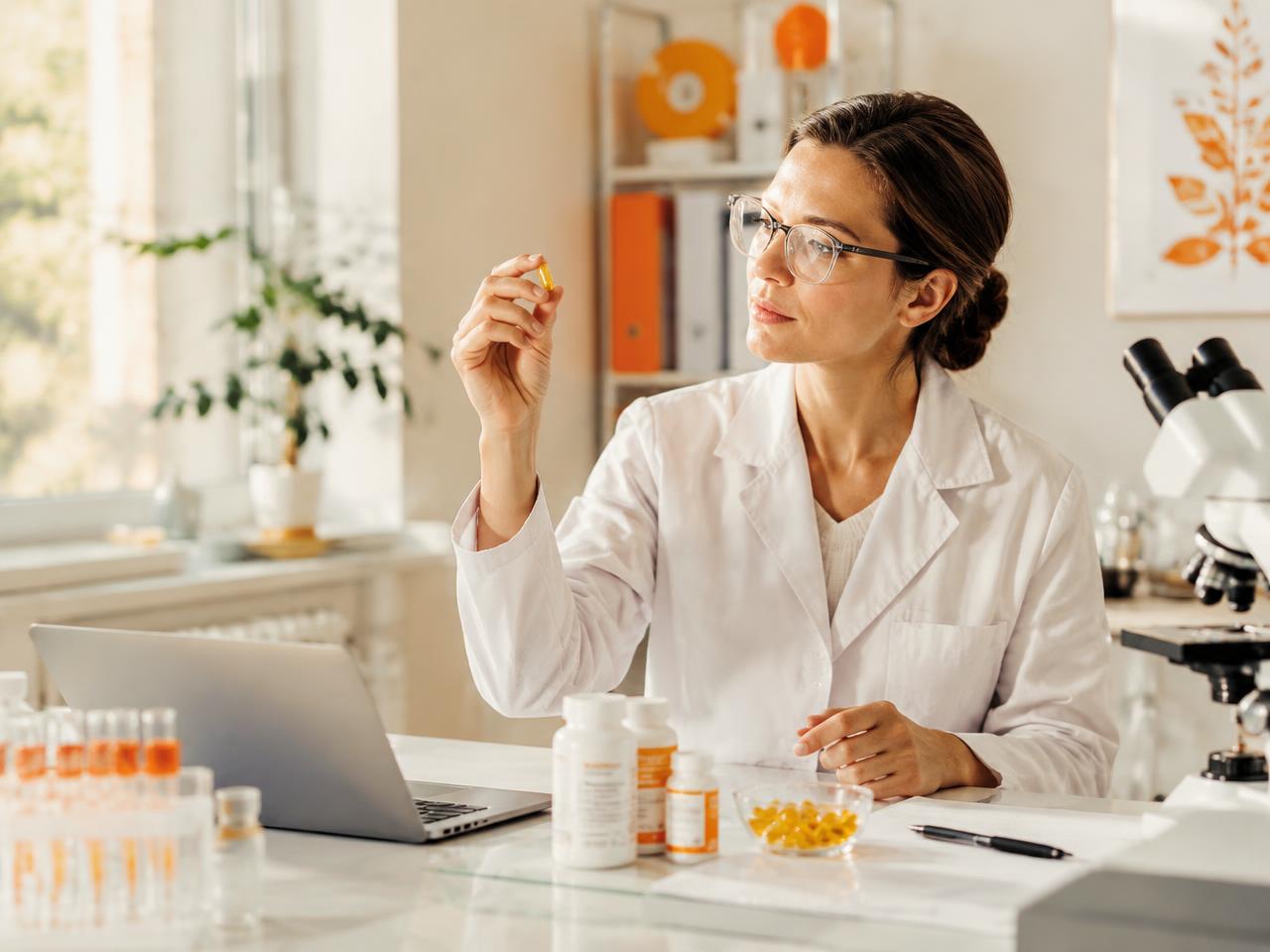 Quality specialist inspecting a capsule